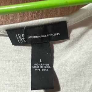 Women’s gently used sequined tank top. Front has sequins over print.